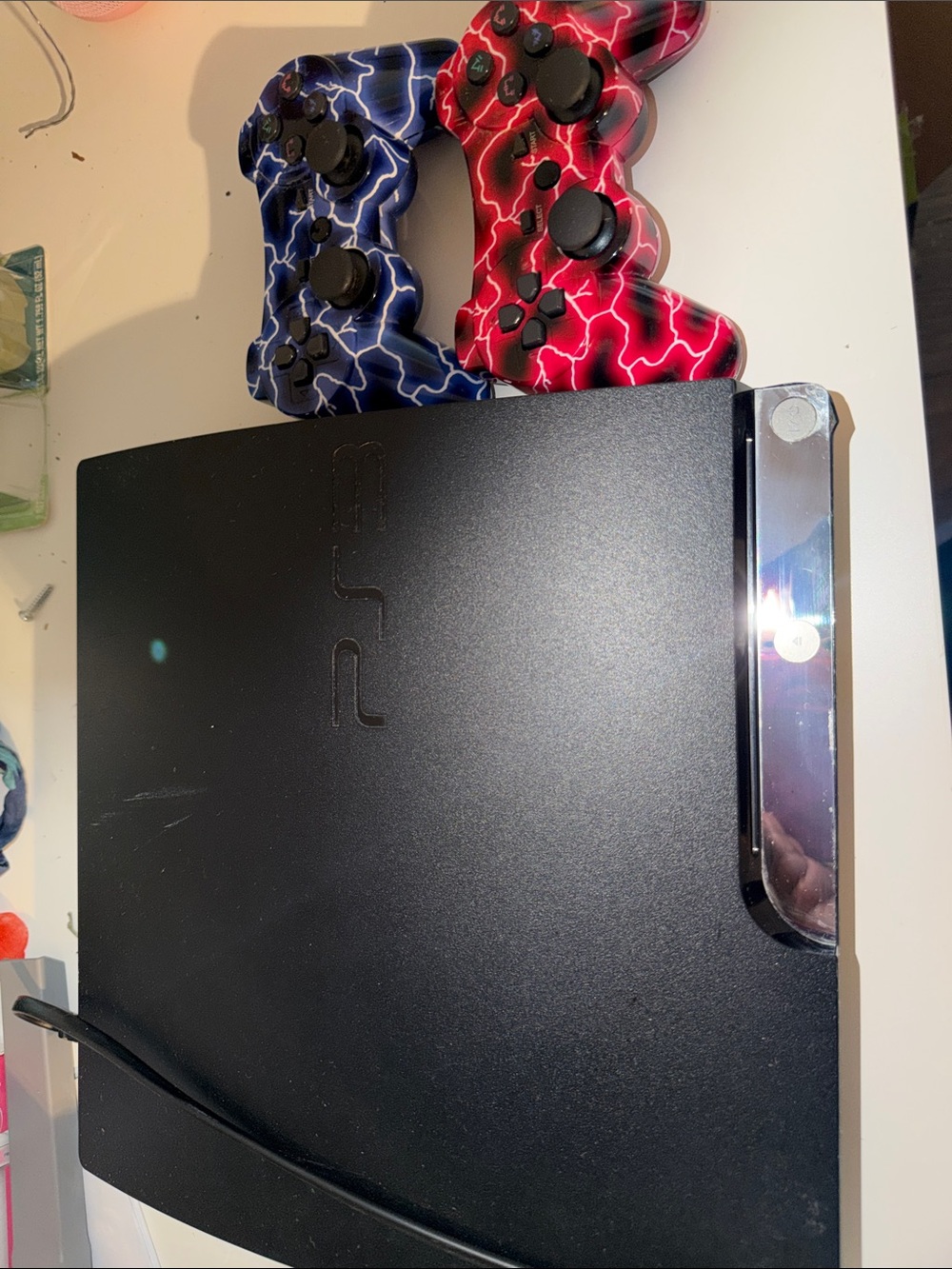 Sony PS3 Slim Black Console with Blue and Red Lightning Controllers